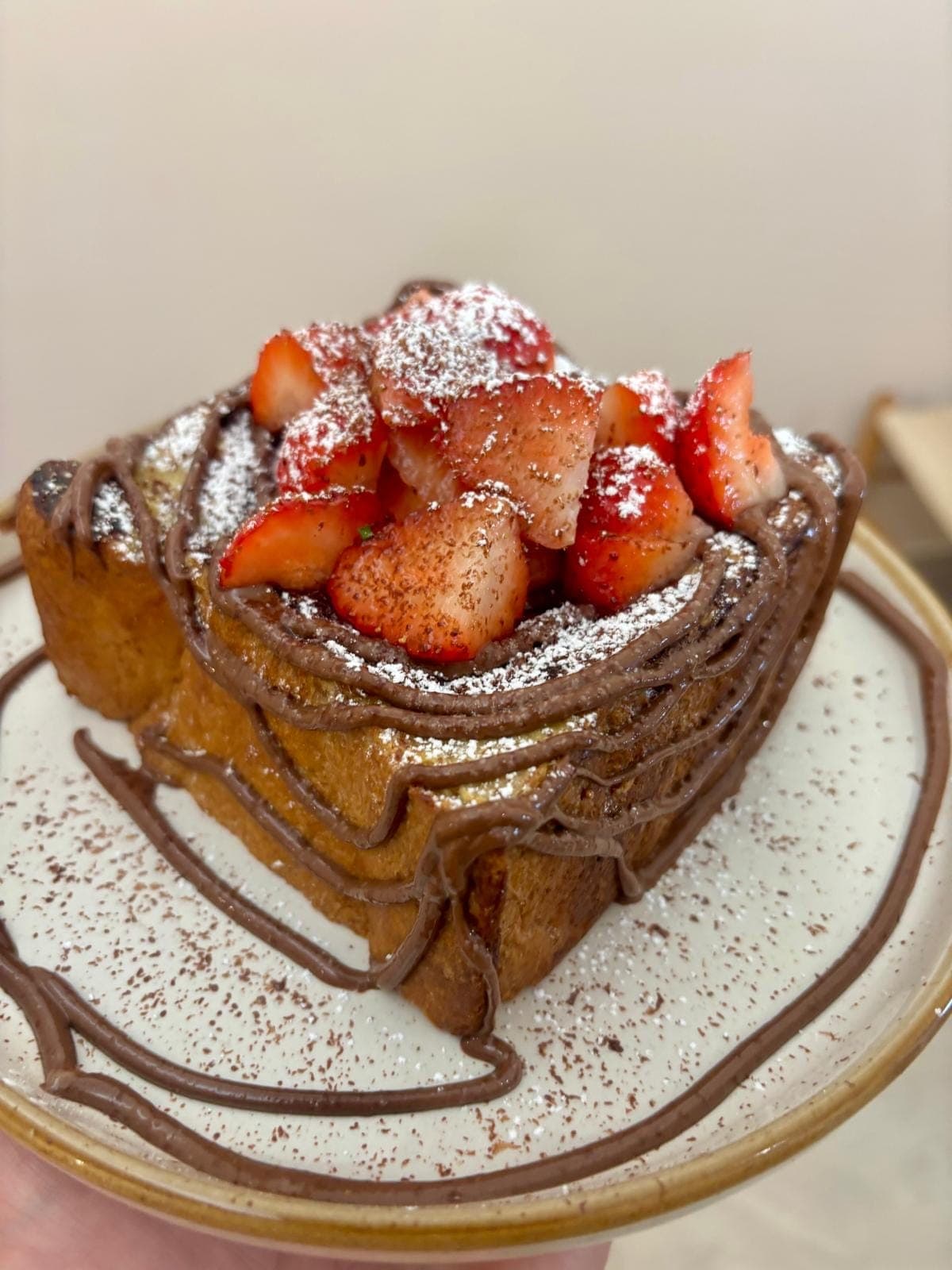 Nutella and strawberry French toast dusted with icing sugar at TOAST & Co in Derby