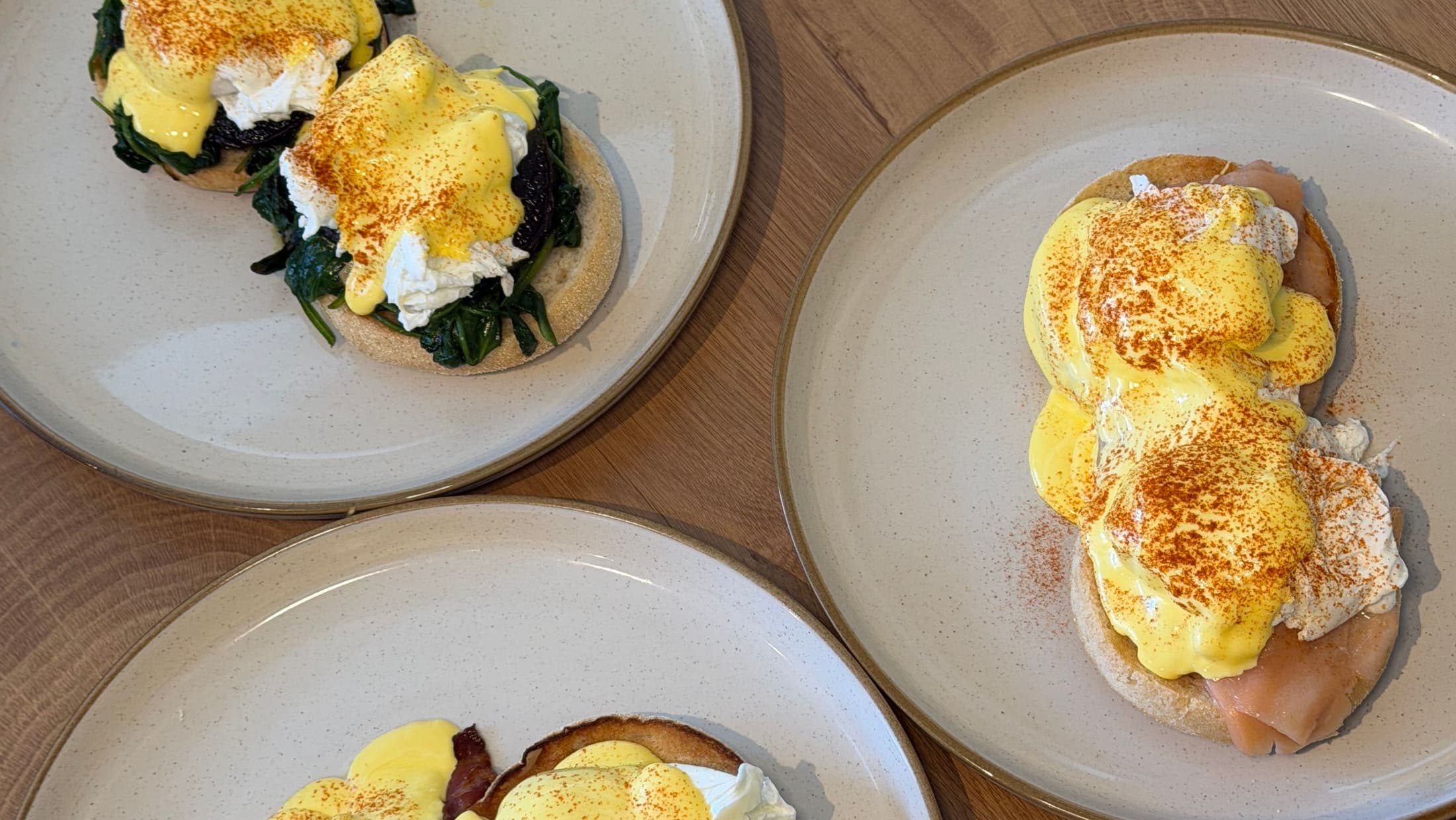 Eggs Royale, Eggs Benedict and Eggs Florentine on English muffins, served at TOAST & Co in Derby