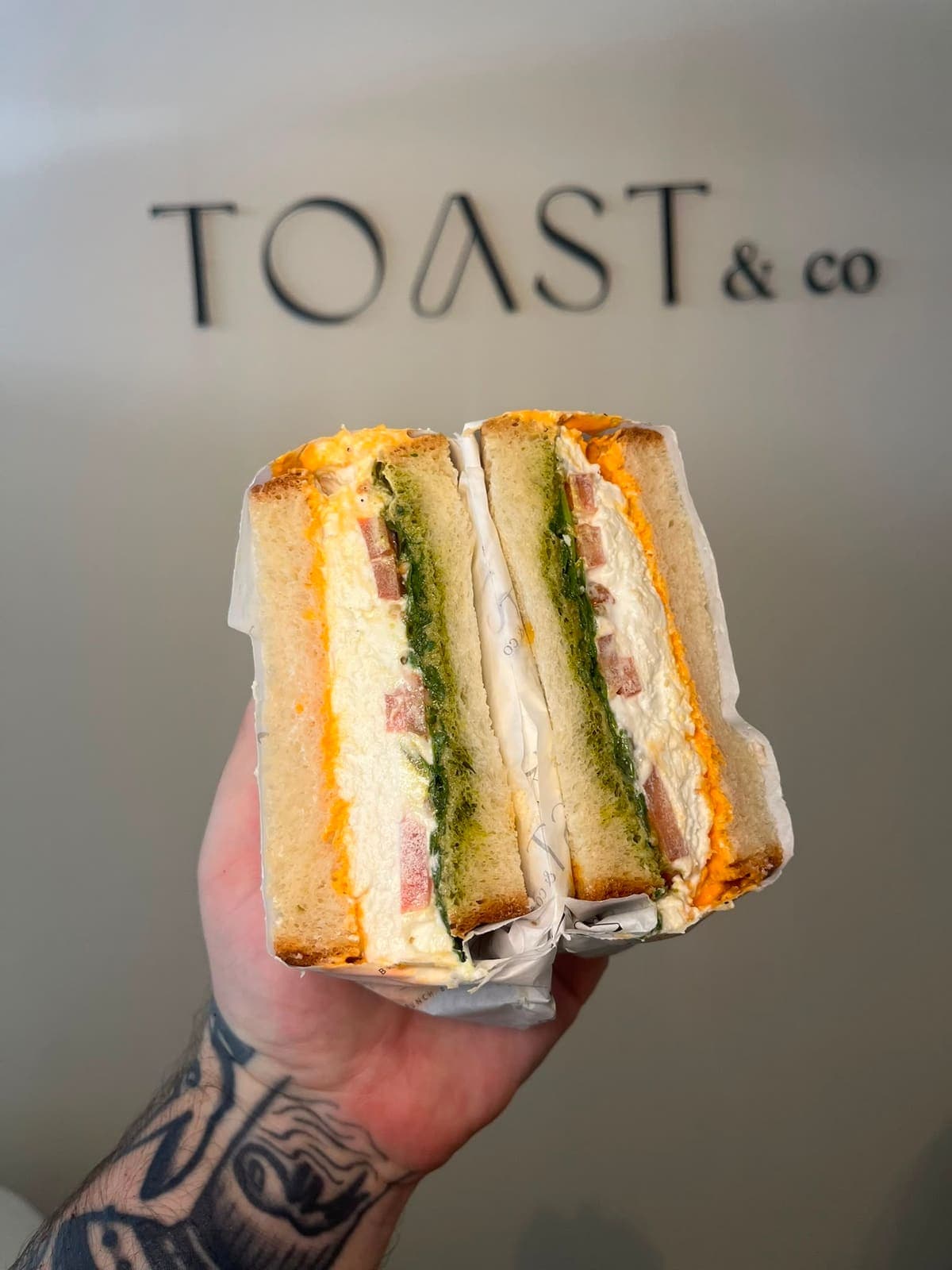 Feta Frustato sandwich with basil pesto and romesco mayo on farmhouse bread at TOAST & Co Derby